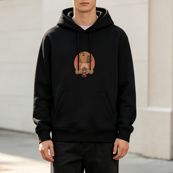 Black hoodie with a meditating capybara graphic print