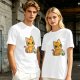 Olive T-shirt with mischievous orange cat knocking over green cup print