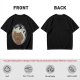 Olive T-shirt with a terrified gingerbread man and flying birds graphic
