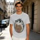 Olive T-shirt with a terrified gingerbread man and flying birds graphic