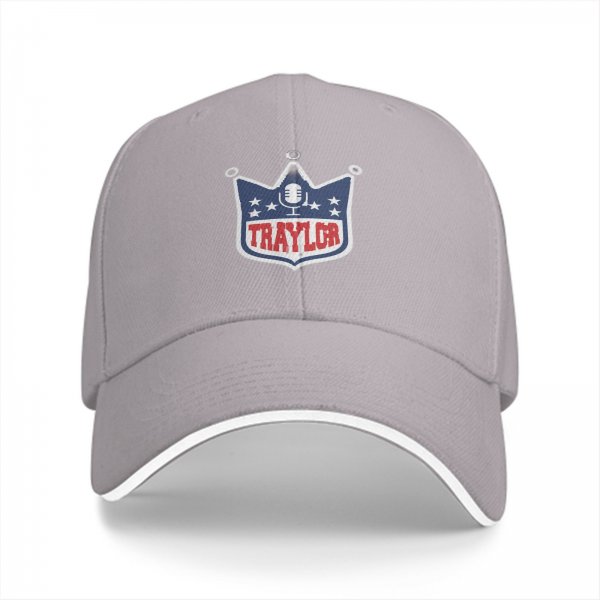 Black baseball cap with TRAYLOR crown shield logo and microphone design