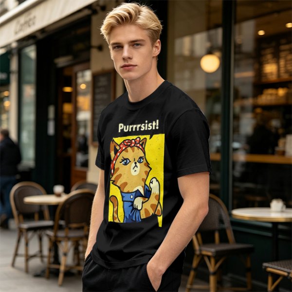 Olive green t-shirt with a cat in a Rosie the Riveter pose and 'Purrrsist!' text