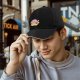 Black baseball cap featuring Kirby eating ramen