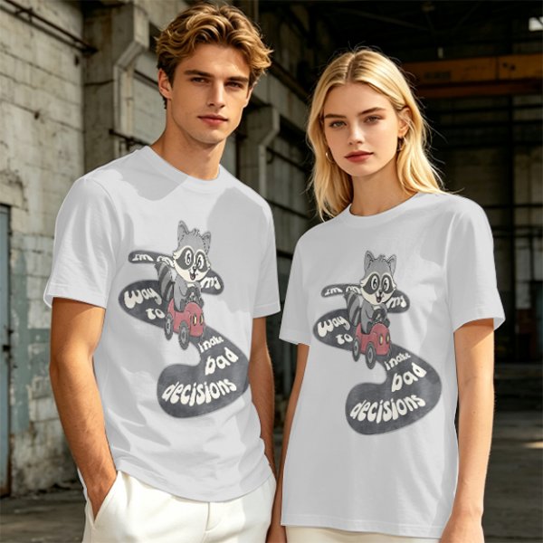 Olive graphic tee with raccoon driving car and 'Way to make bad decisions' text