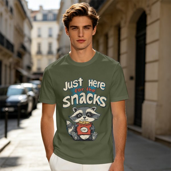 Olive green t-shirt with 'Just Here for the Snacks' and raccoon graphic