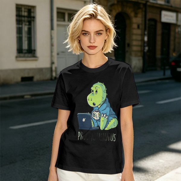 Olive t-shirt with a cartoon dinosaur working on laptop holding coffee