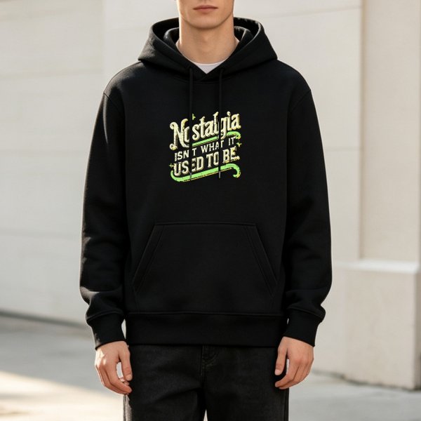 Black hoodie with nostalgic text print that reads Nostalgia isn't what it used to be