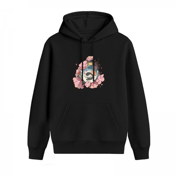 Black hoodie with sleeping cat in potion bottle surrounded by pink cherry blossoms
