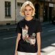 Olive green graphic tee with a sloth relaxing between anthropomorphic coffee mugs