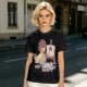 Olive T-Shirt Featuring a Bird Painting a Self-Portrait with an Afro