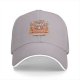 Black baseball cap with cozy raccoon on armchair and stay cozy print