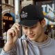 Black baseball cap with sushi graphic and 'I Like The Way You Roll' text