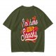 Olive green graphic tee with 'I'm here for the snacks' print