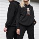 Black hoodie with a masked bunny graphic and 'Save the planet eat humans' text