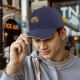Black baseball cap with Dark Souls themed graphic print