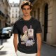 Olive T-Shirt Featuring a Bird Painting a Self-Portrait with an Afro