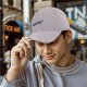 Black baseball cap with 'The Less You Know' retro graphic