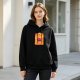 Black hoodie with vibrant sunset pirate ship and crew graphic
