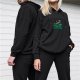 Black hoodie with raccoon chilling on green dumpster graphic