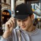 Black Baseball Cap With Small D20 Dice Graphic On Front