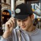Black baseball cap with whimsical magical plant and mushroom graphic