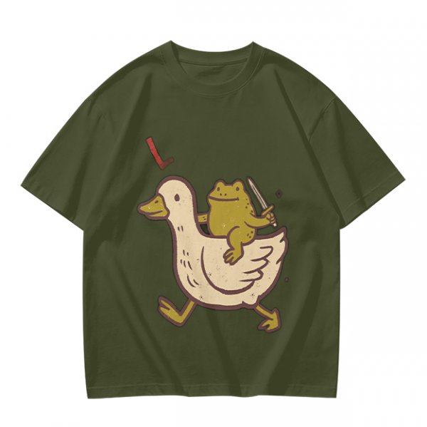 Olive T-Shirt Featuring Frog Riding Duck Holding Knife