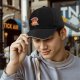 Black baseball cap with flame and banner graphic design