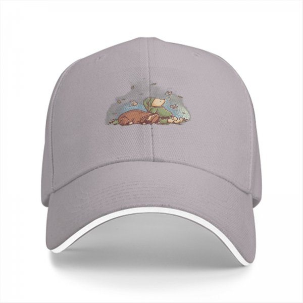 Black baseball cap with whimsical sleeping character and butterfly print