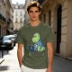 Olive t-shirt with a cartoon dinosaur working on laptop holding coffee