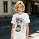 Olive graphic tee with Wednesday and Enid cartoon wolf design