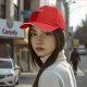 Black baseball cap with 'All of Us Are Red' text and red graphic