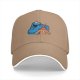 Black baseball cap with Cookie Monster covering a gingerbread man’s eyes
