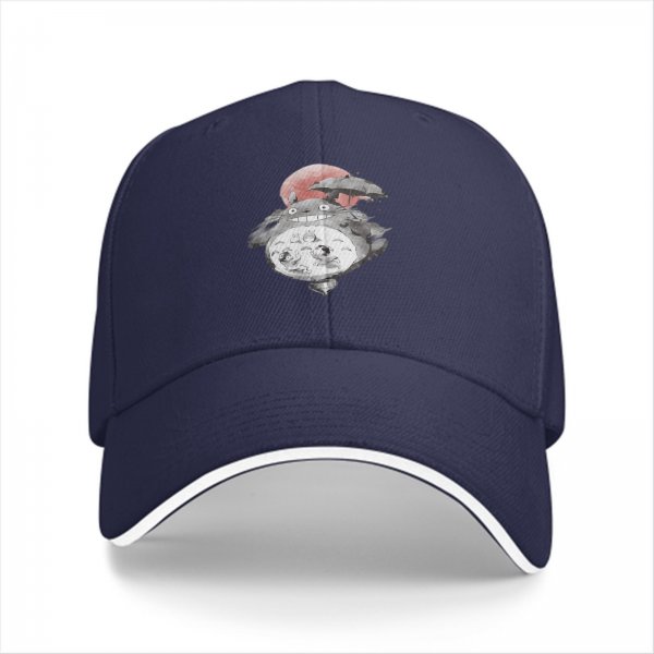 Black baseball cap with Totoro holding umbrella and red sun graphic